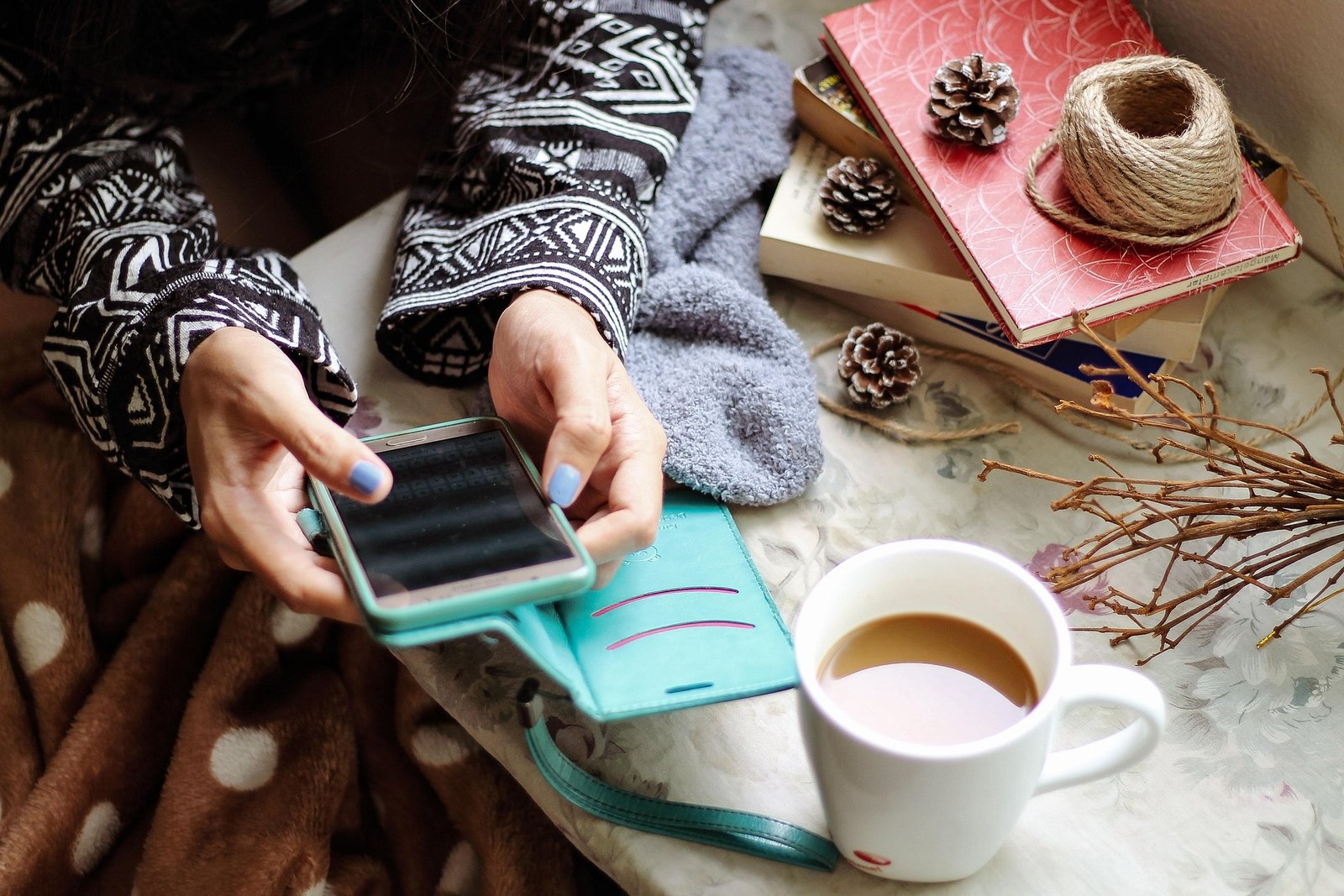 Digital Detox Lite: woman holding smartphone beside morning coffee and cake