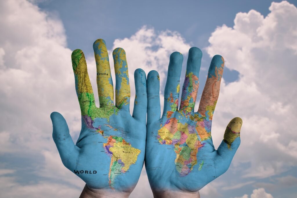 Hands holding a world map outdoors representing strange laws around the world 